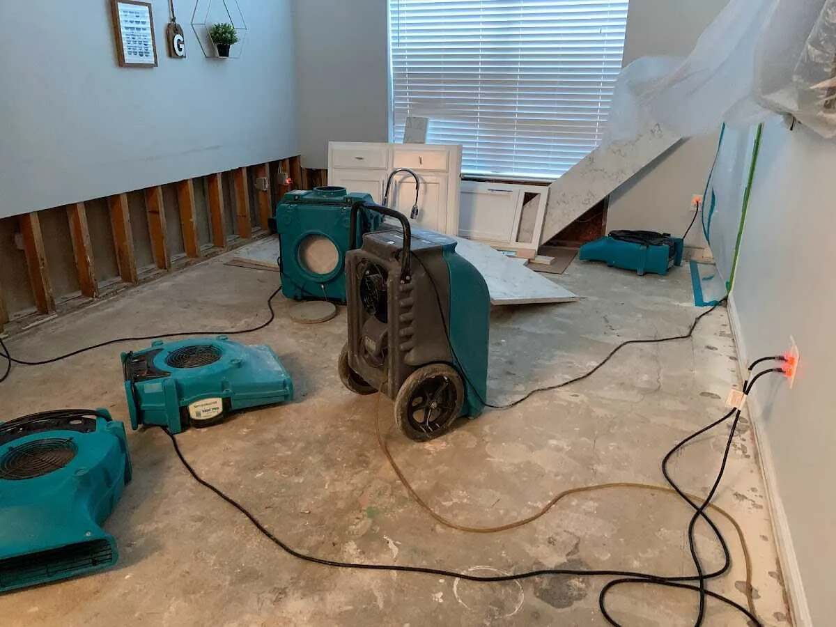 Dehumidifier in flood-cut room for Water Damage Restoration in Alfred
